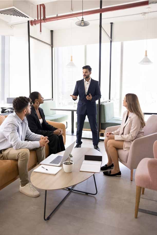 Business advisor presenting to a seated team